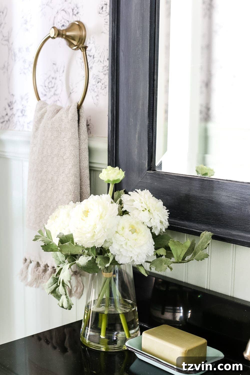 Simple Floral Arrangement Powder Room | blesserhouse.com - A dated powder room gets a modern meets traditional, urban meets farmhouse makeover with aquas, black and white, and antique brass. 