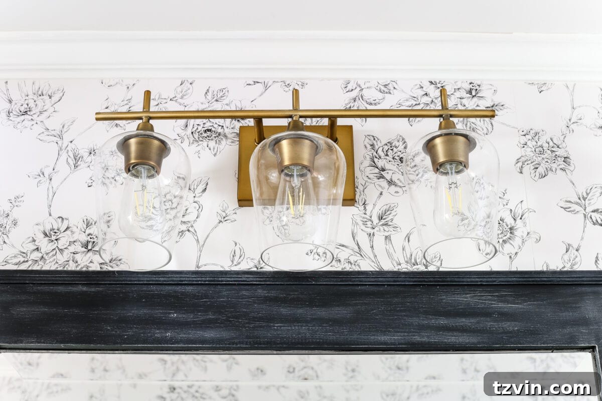 Brass Vanity Light Powder Room | blesserhouse.com - A dated powder room gets a modern meets traditional, urban meets farmhouse makeover with aquas, black and white, and antique brass. 