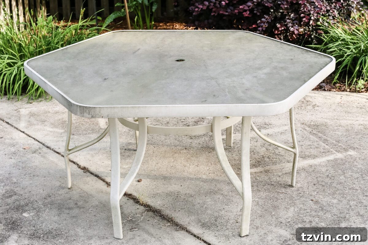From Grimy to Gleaming: Deep Cleaning Your Outdoor Glass Dining Table 3 How to Revive a Glass Patio Table | blesserhouse.com - A tutorial explaining how to clean, paint, and revive a glass patio table to make it look brand new in a few quick steps.