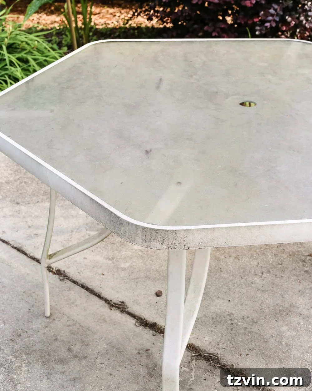 From Grimy to Gleaming: Deep Cleaning Your Outdoor Glass Dining Table 4 How to Revive a Glass Patio Table | blesserhouse.com - A tutorial explaining how to clean, paint, and revive a glass patio table to make it look brand new in a few quick steps.