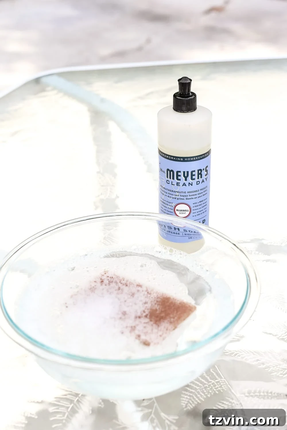 From Grimy to Gleaming: Deep Cleaning Your Outdoor Glass Dining Table 5 How to Revive a Glass Patio Table | blesserhouse.com - A tutorial explaining how to clean, paint, and revive a glass patio table to make it look brand new in a few quick steps.