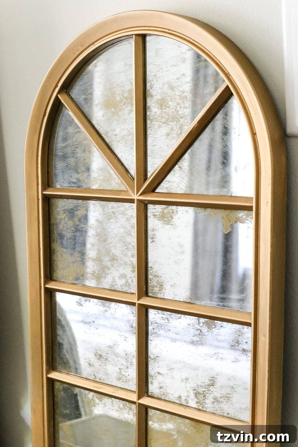Before and after comparison of the mirror makeover