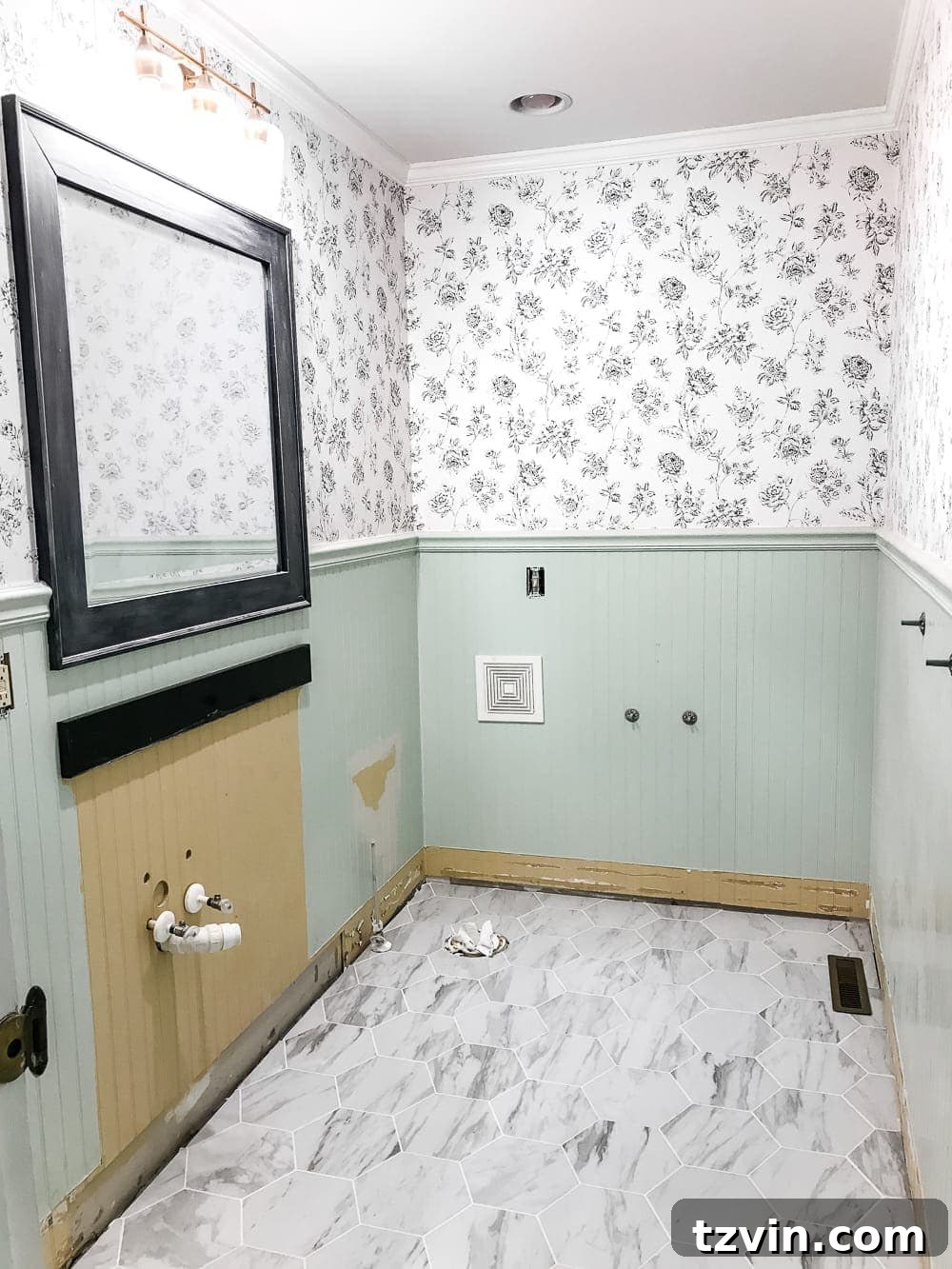 Powder Room Radiance: Faux Marble Tile Floor Upgrade 11 The newly installed faux marble hexagon tile, gleaming and ready for the final touches of the powder room renovation, signifying a major milestone in the home improvement project.