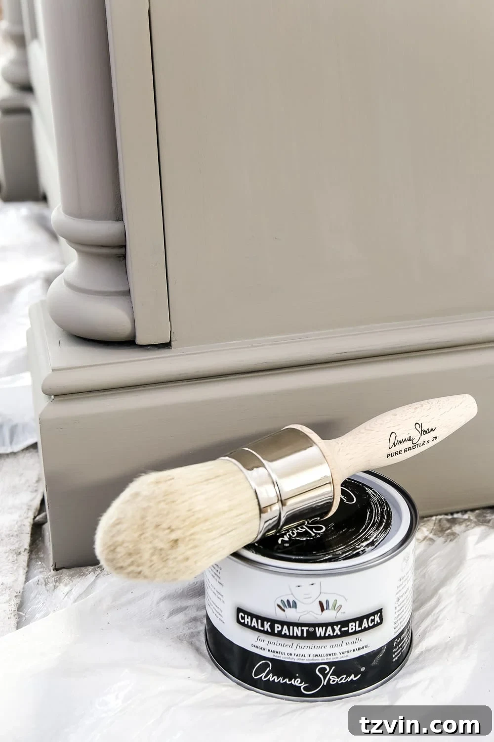 Rustic Gray Wood Vanity Transformation 4 Applying Annie Sloan black wax to the painted vanity to create a weathered wood effect.