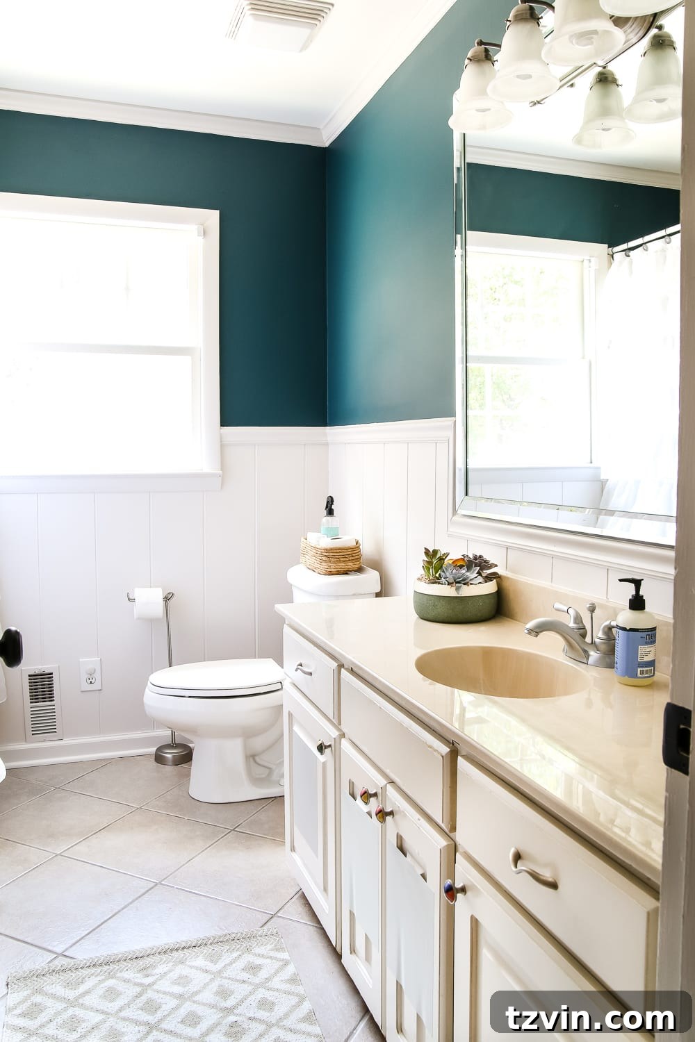 Teal Painted Bathroom Glow Up 3 Teal Painted Bathroom Makeover | blesserhouse.com - A boring, dated beige bathroom gets a fresh teal painted makeover with Magnolia Home Paint in the color Weekend and Ben Moore Simply White and Wrought Iron.