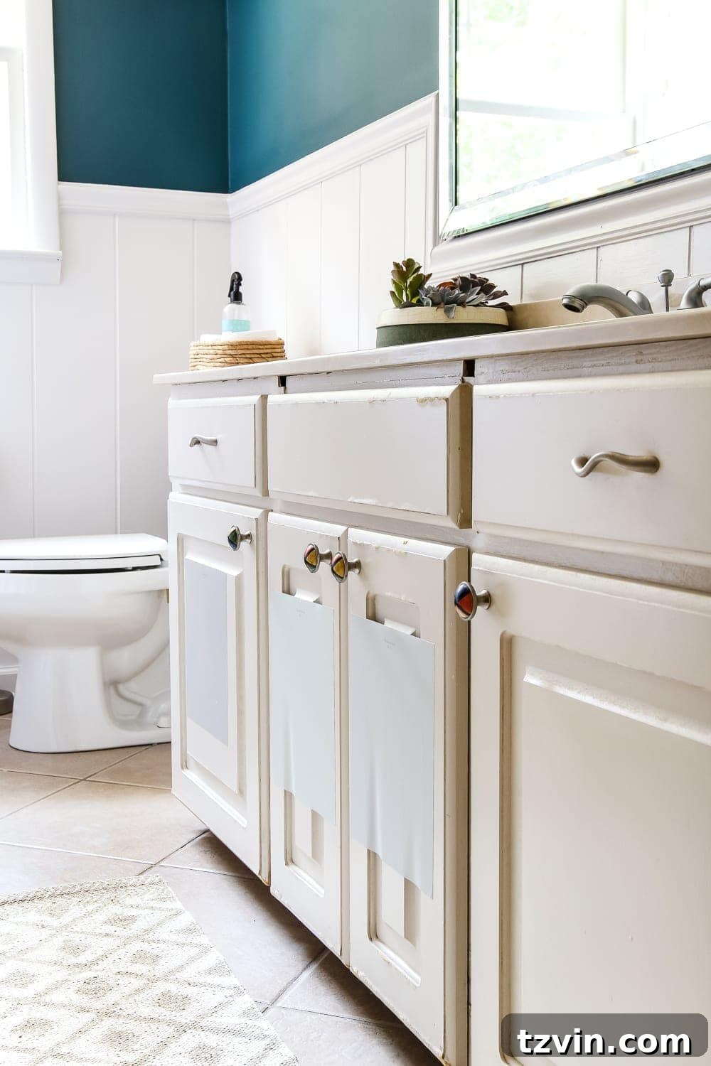 Teal Painted Bathroom Glow Up 8 Teal Painted Bathroom Makeover | blesserhouse.com - A boring, dated beige bathroom gets a fresh teal painted makeover with Magnolia Home Paint in the color Weekend and Ben Moore Simply White and Wrought Iron.