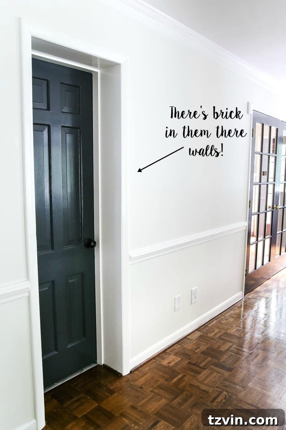 Hidden Brick Wall Behind Drywall - A homeowner's guide to hanging heavy art on challenging walls without studs.