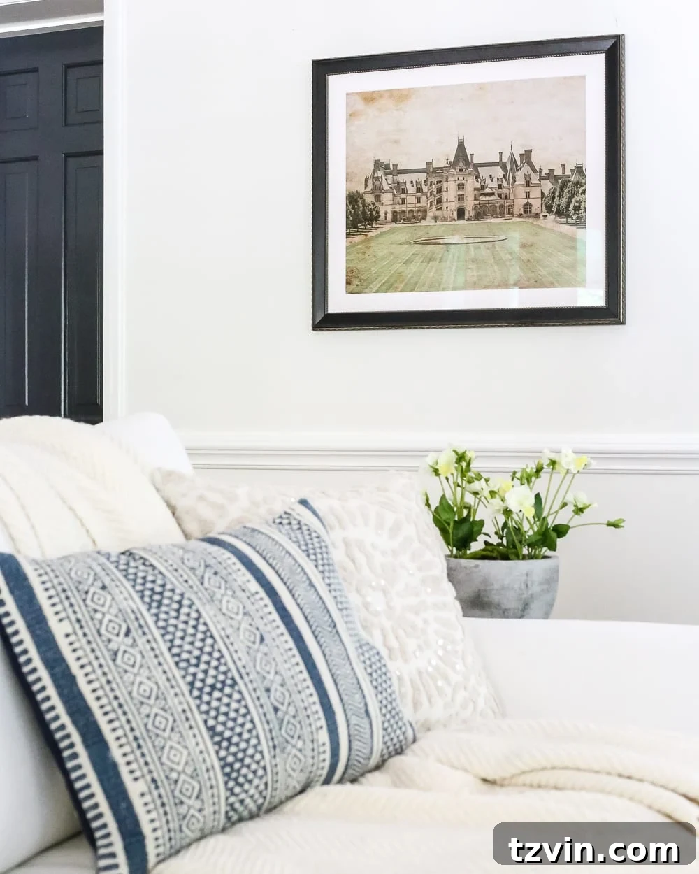 Finished living room with Biltmore art, hung effortlessly on drywall without studs.