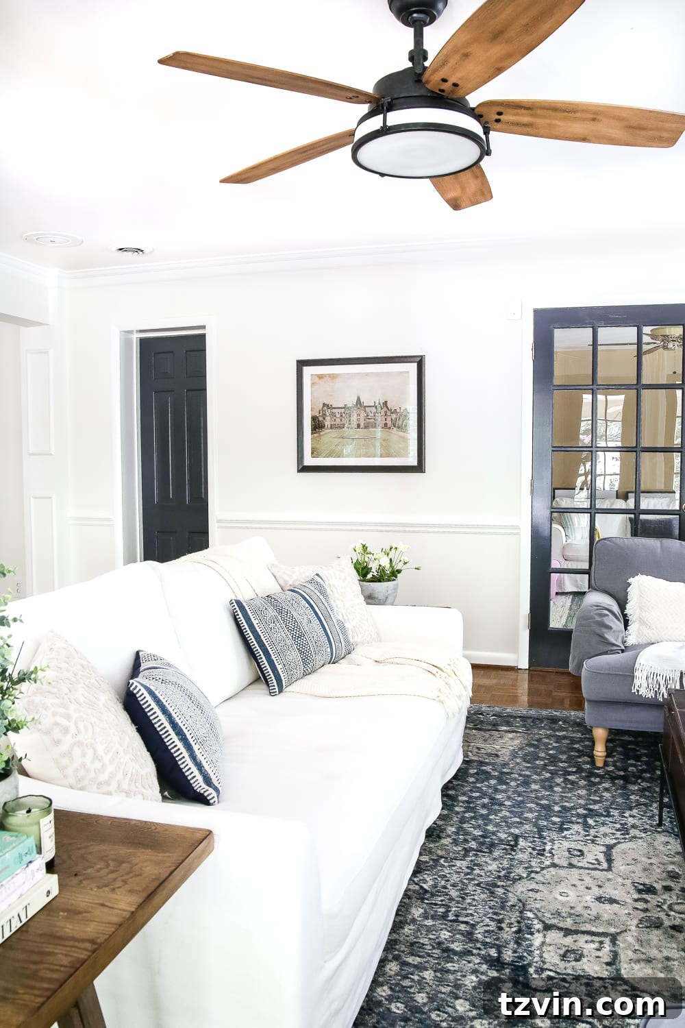 Beautifully decorated living room featuring art hung with damage-free High & Mighty hangers.