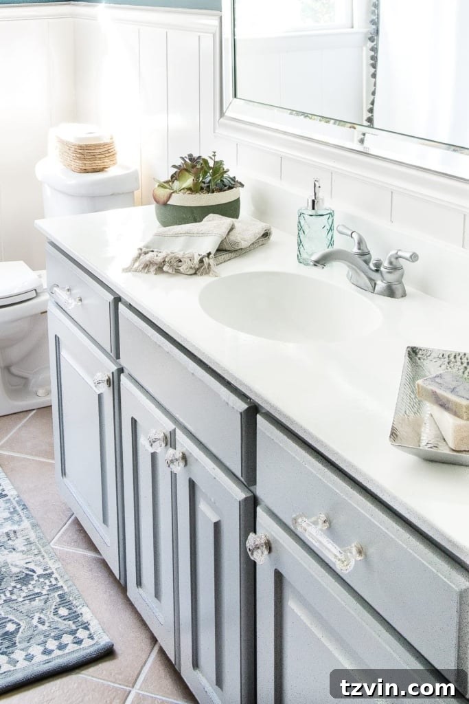 Transform Your Bathroom Counter with Paint 2 Transformed bright white bathroom sink and countertop