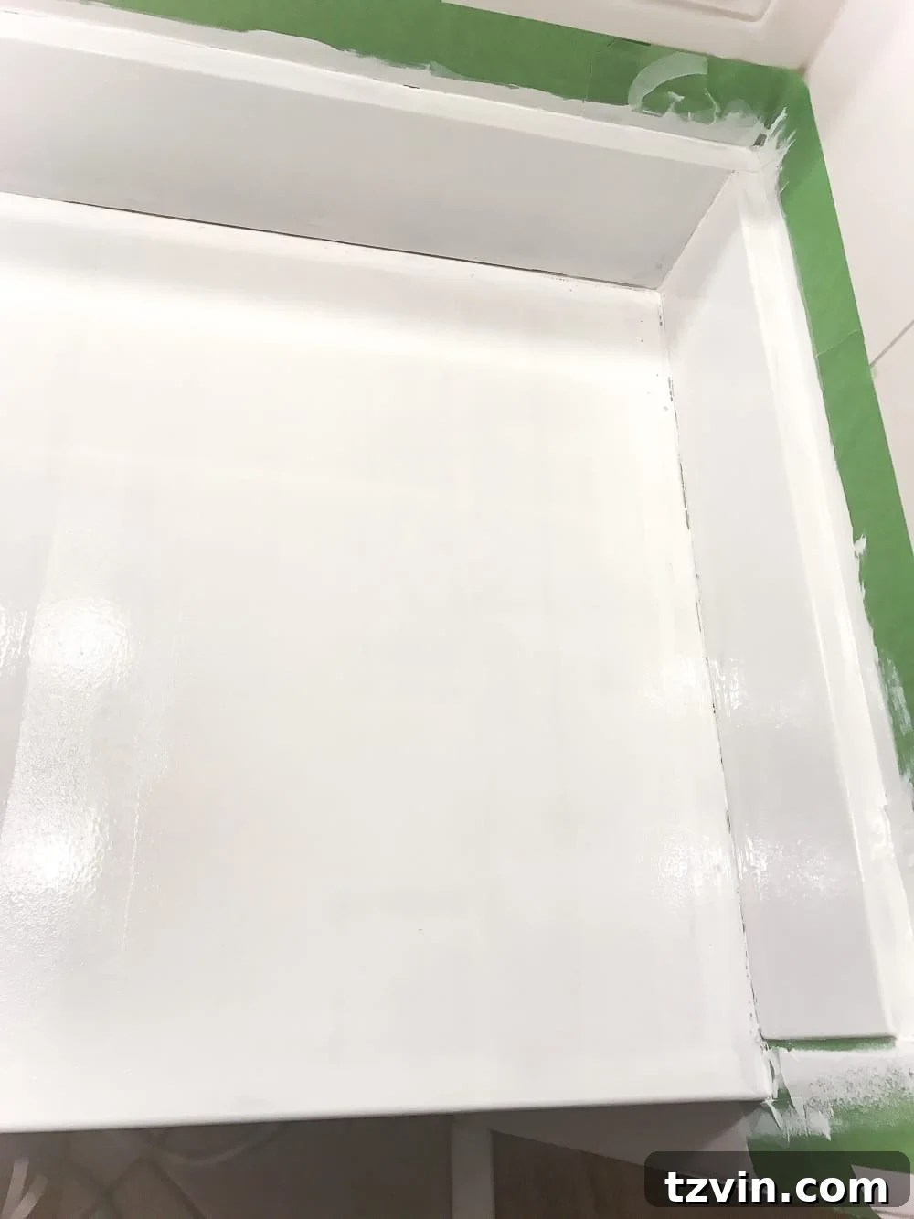 Transform Your Bathroom Counter with Paint 15 painting a countertop sink using a tub and tile refinishing kit with a foam roller