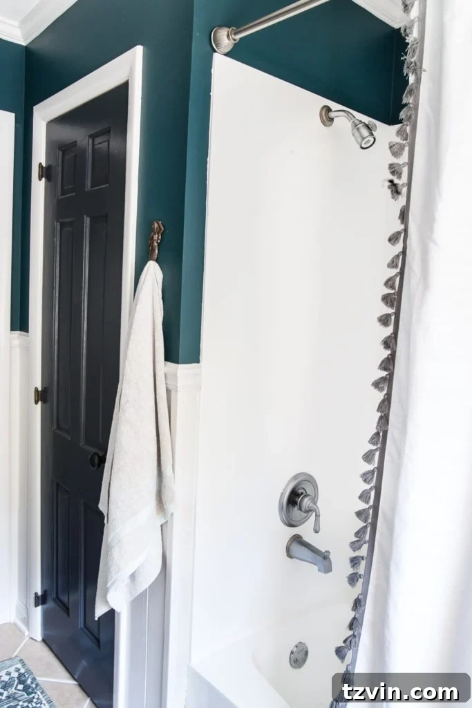 Transform Your Bathroom Counter with Paint 7 After image of bright white painted tub and shower