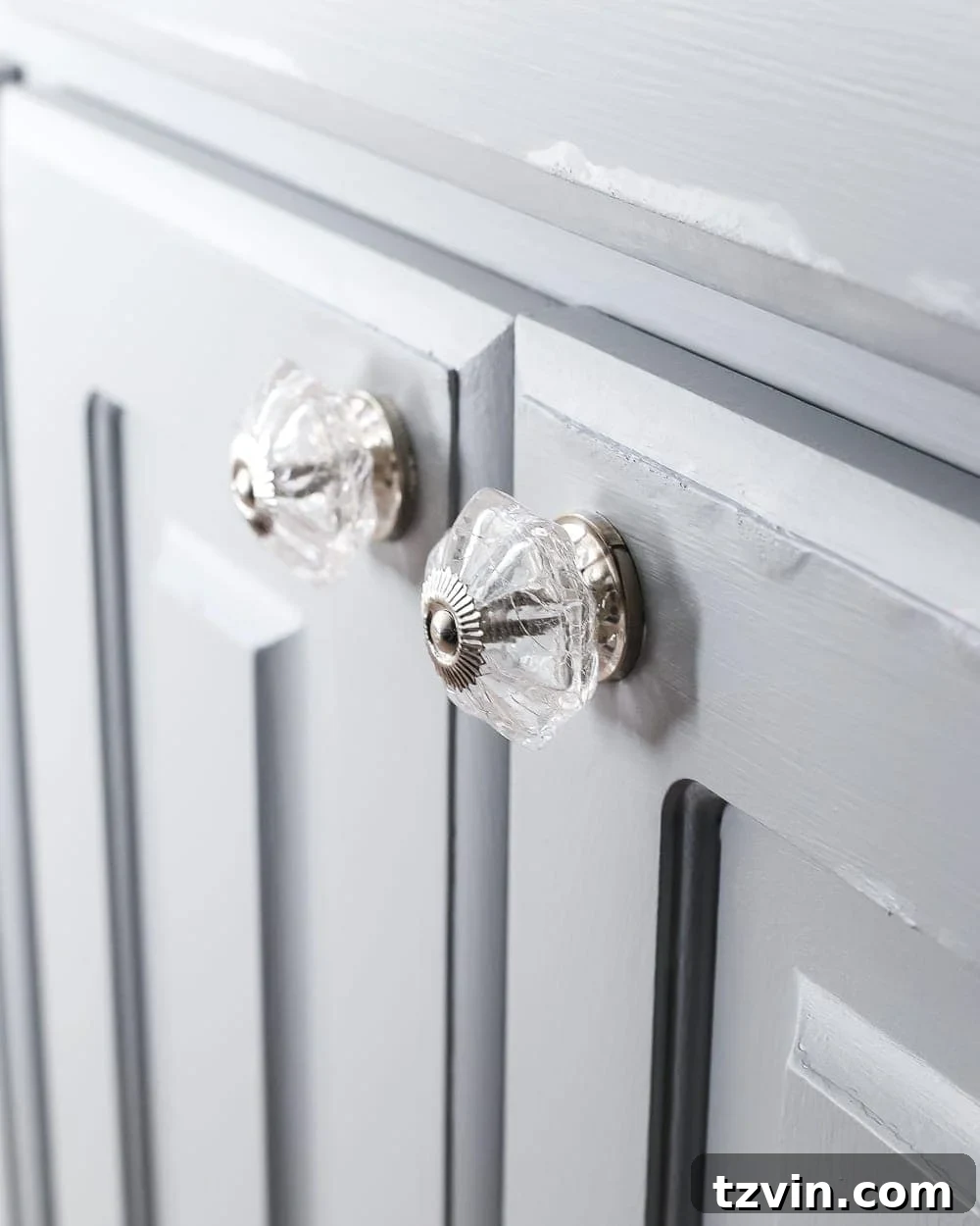 Glass Knobs and Pulls on Painted Bathroom Vanity - Elegant hardware upgrade for a chic bathroom makeover.