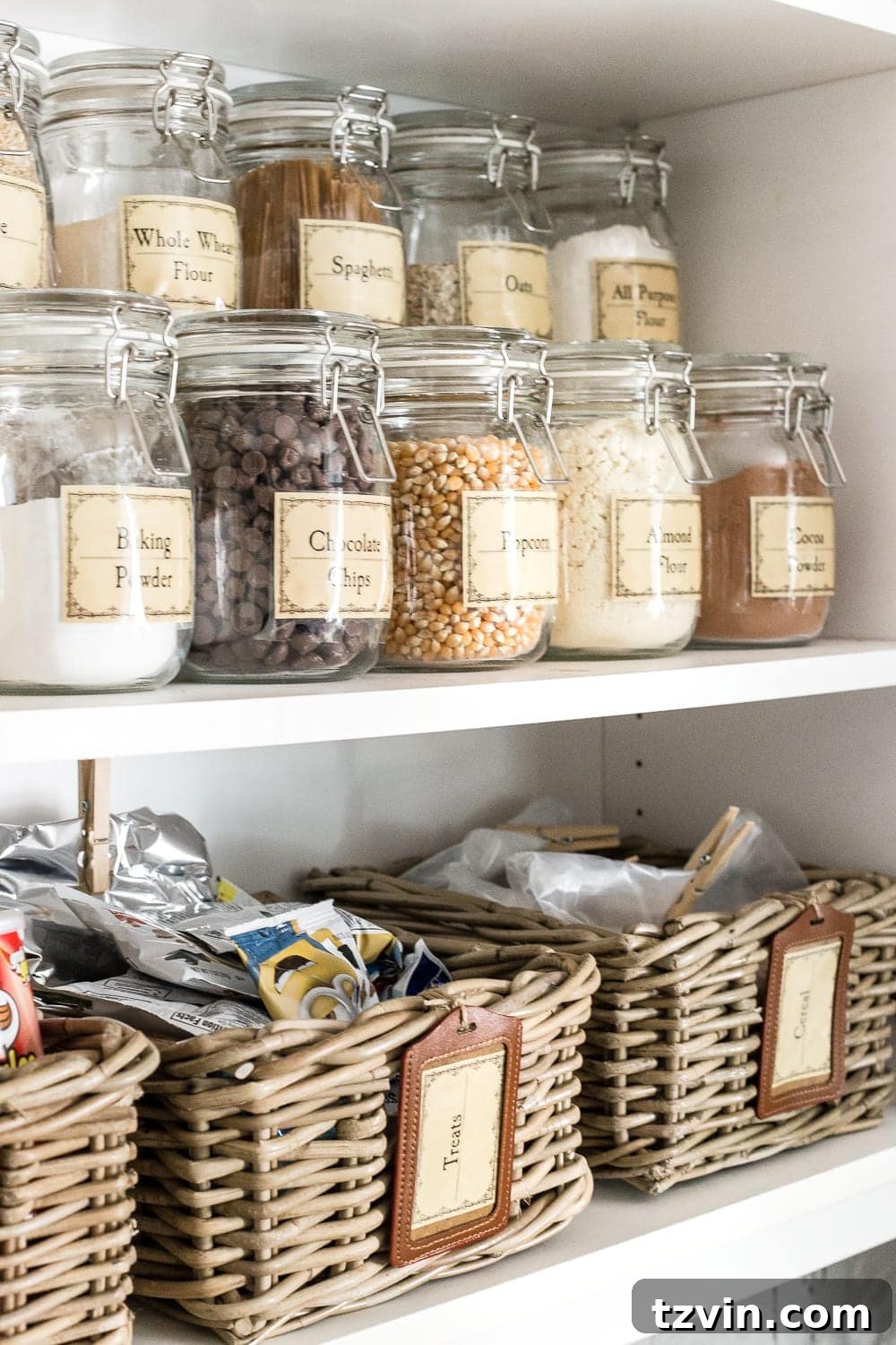 Pantry Cabinet Organization and Free Printable Label Set | blesserhouse.com - A cabinet gets a drastic organization makeover using inexpensive IKEA jars / baskets, hanging storage, and a free pantry label printable set. #organization 