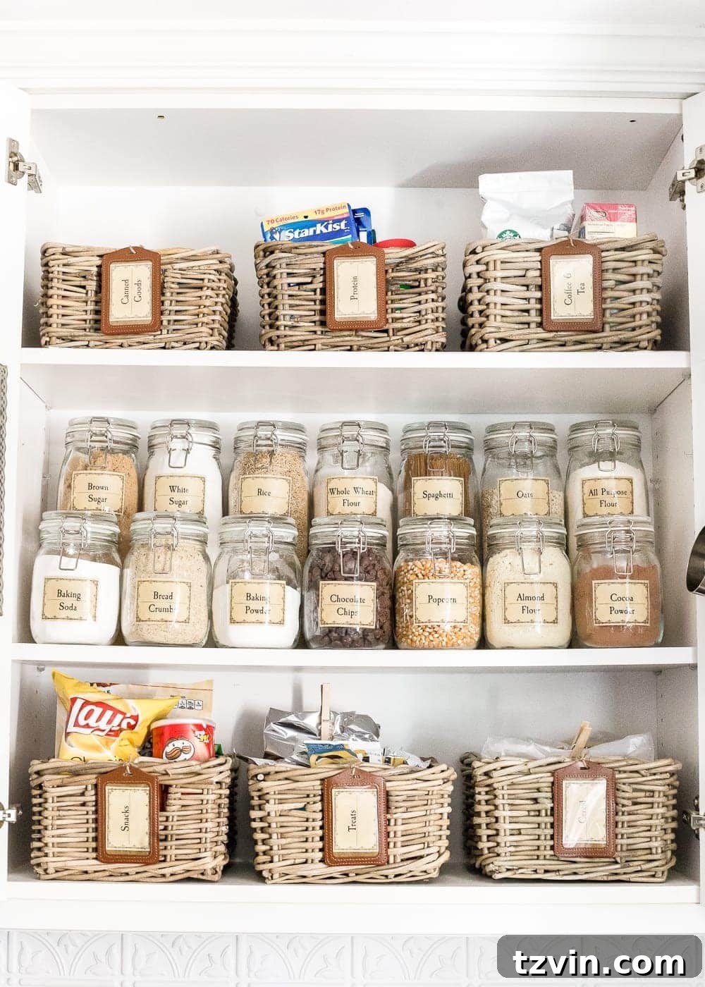 Pantry Cabinet Organization and Free Printable Label Set | blesserhouse.com - A cabinet gets a drastic organization makeover using inexpensive IKEA jars / baskets, hanging storage, and a free pantry label printable set. #organization 