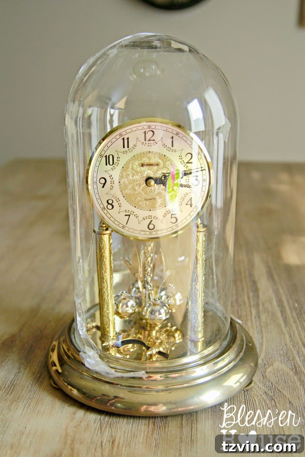 Vintage dome clocks, repurposed for a festive DIY Christmas snow globe project, awaiting their transformation.