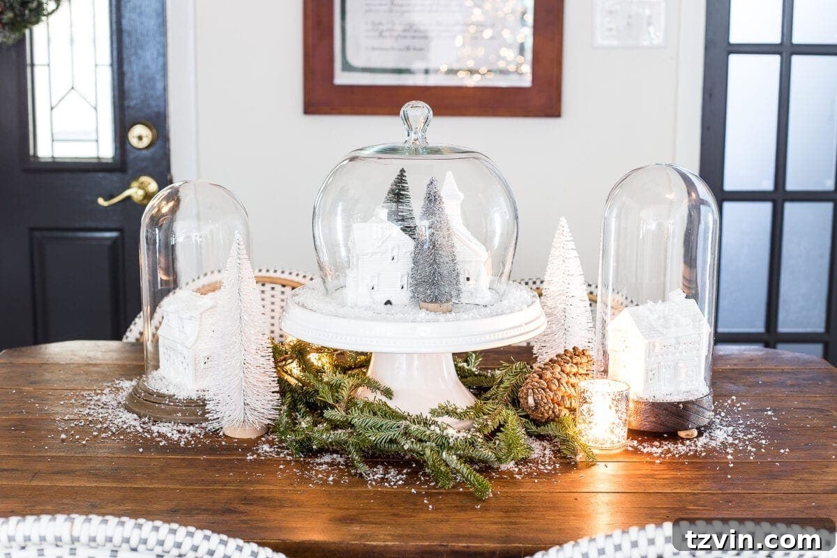 The completed DIY Christmas snow globe centerpiece displayed beautifully on a kitchen table, adding festive warmth.