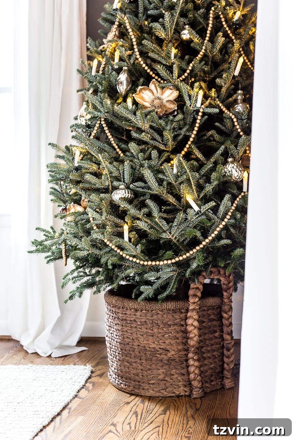 minimalist Christmas tree with garland, candles, and simple ornaments
