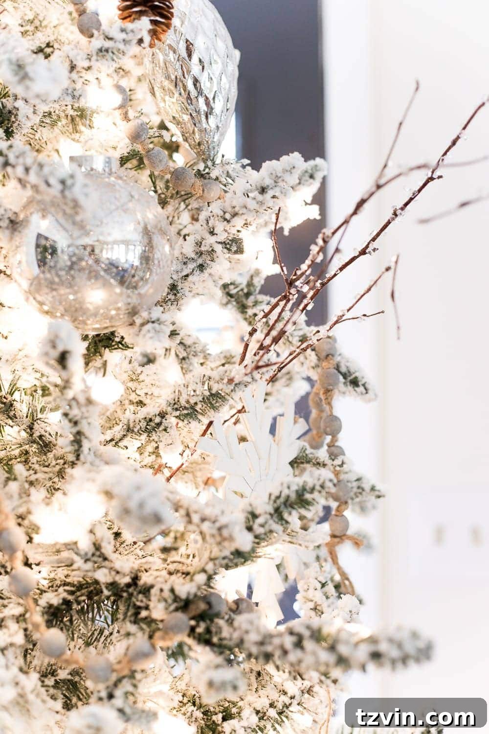 A closer look at Christmas table decor, showcasing layered rugs, a simple centerpiece, and cozy textures in a neutral setting.