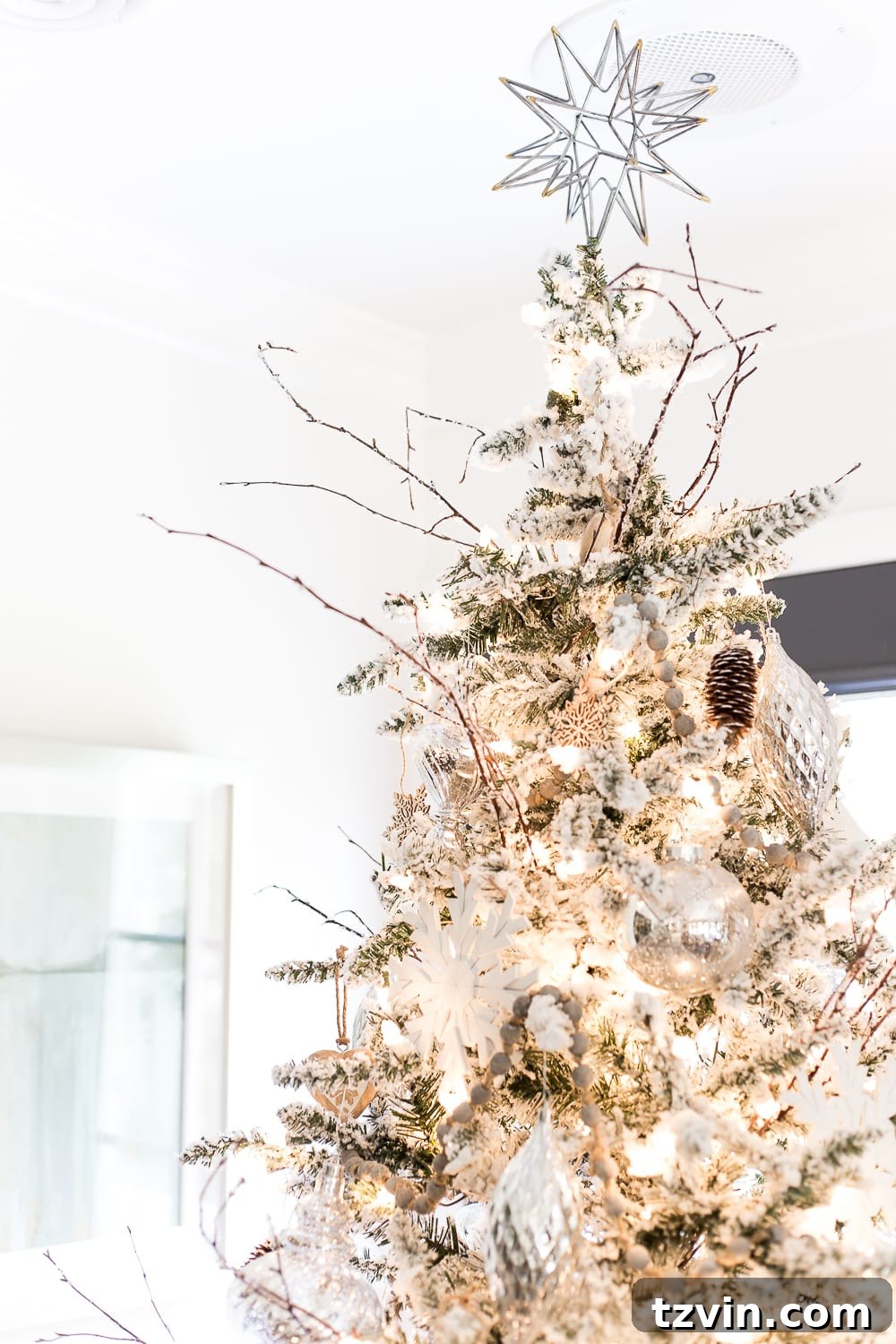A serene Christmas morning scene in a neutral breakfast nook, decorated with minimalist holiday accents.