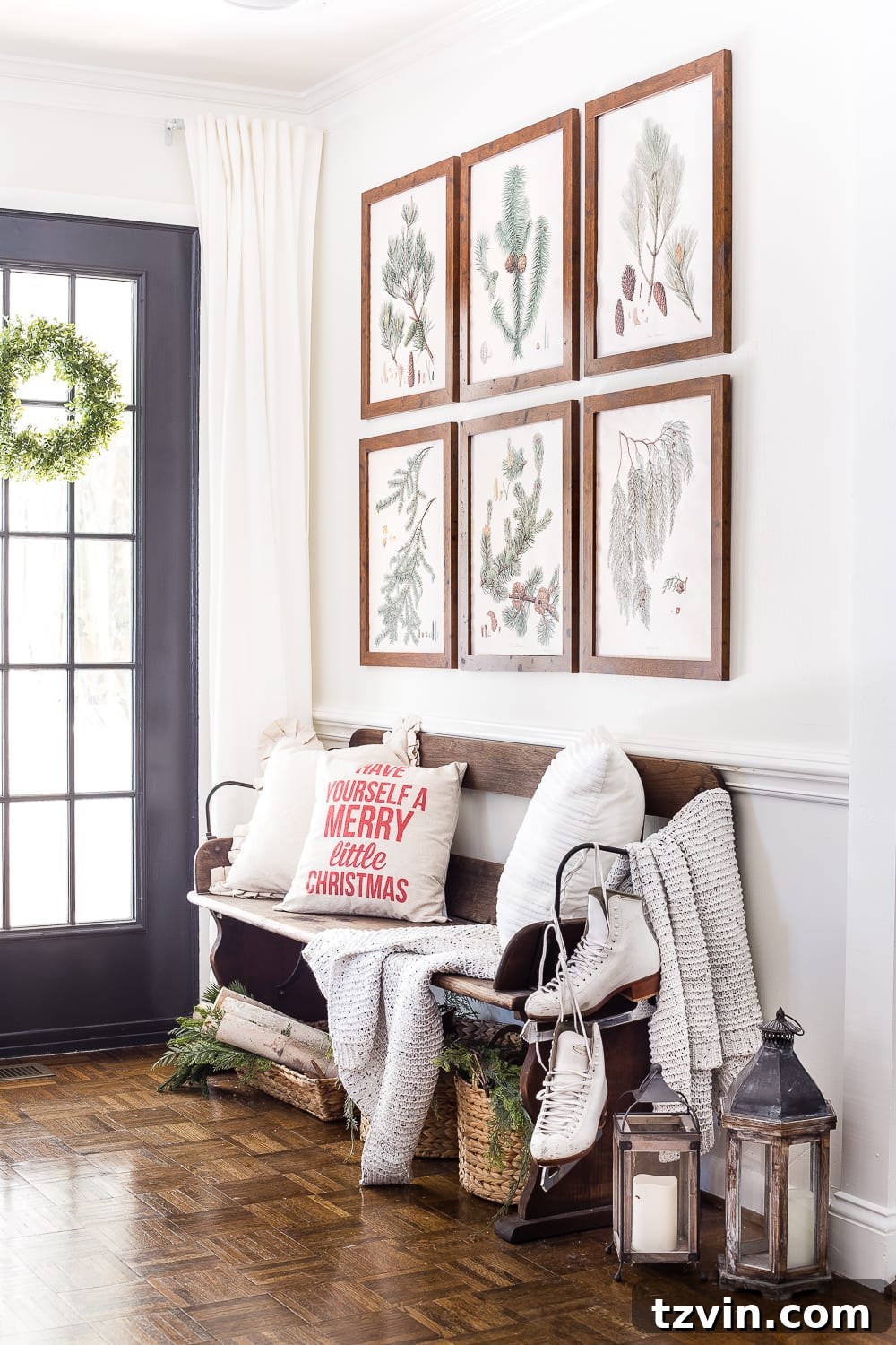 Cozy seating area in a neutral Christmas living room, featuring soft throws and a Silent Night pillow, inviting relaxation.