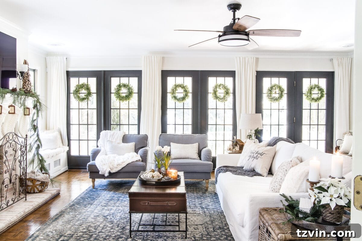 Bright and airy neutral Christmas living room with an abundance of natural light, showcasing simple and elegant holiday decor.