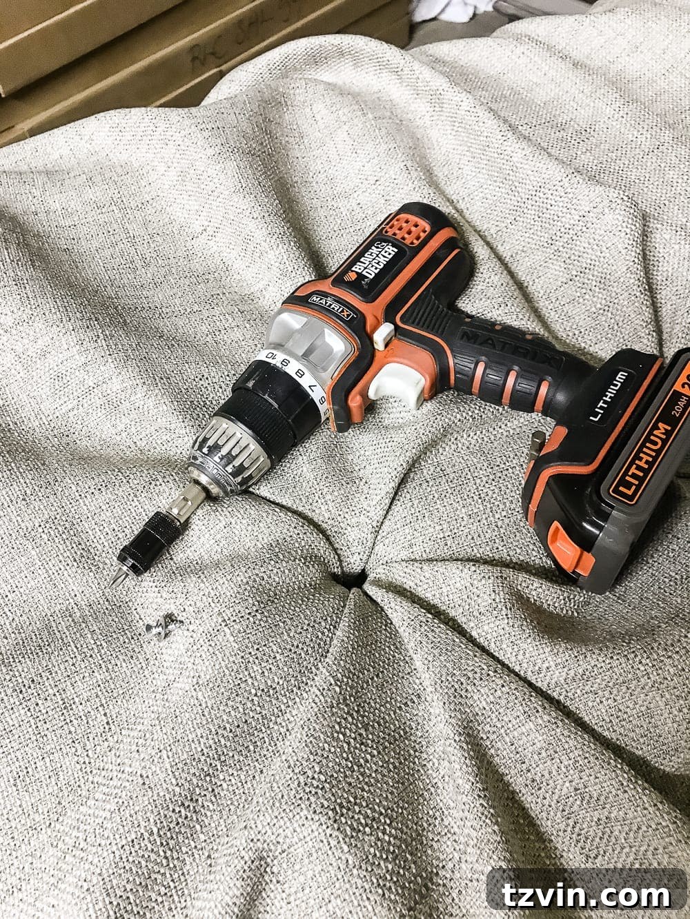 Securing the first tuft with a screw and washer