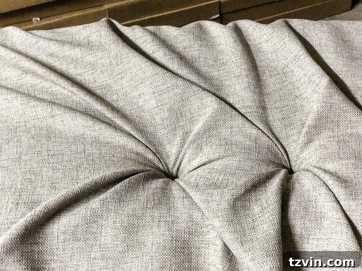 Technique for pulling fabric for adjacent tufts, avoiding puckering