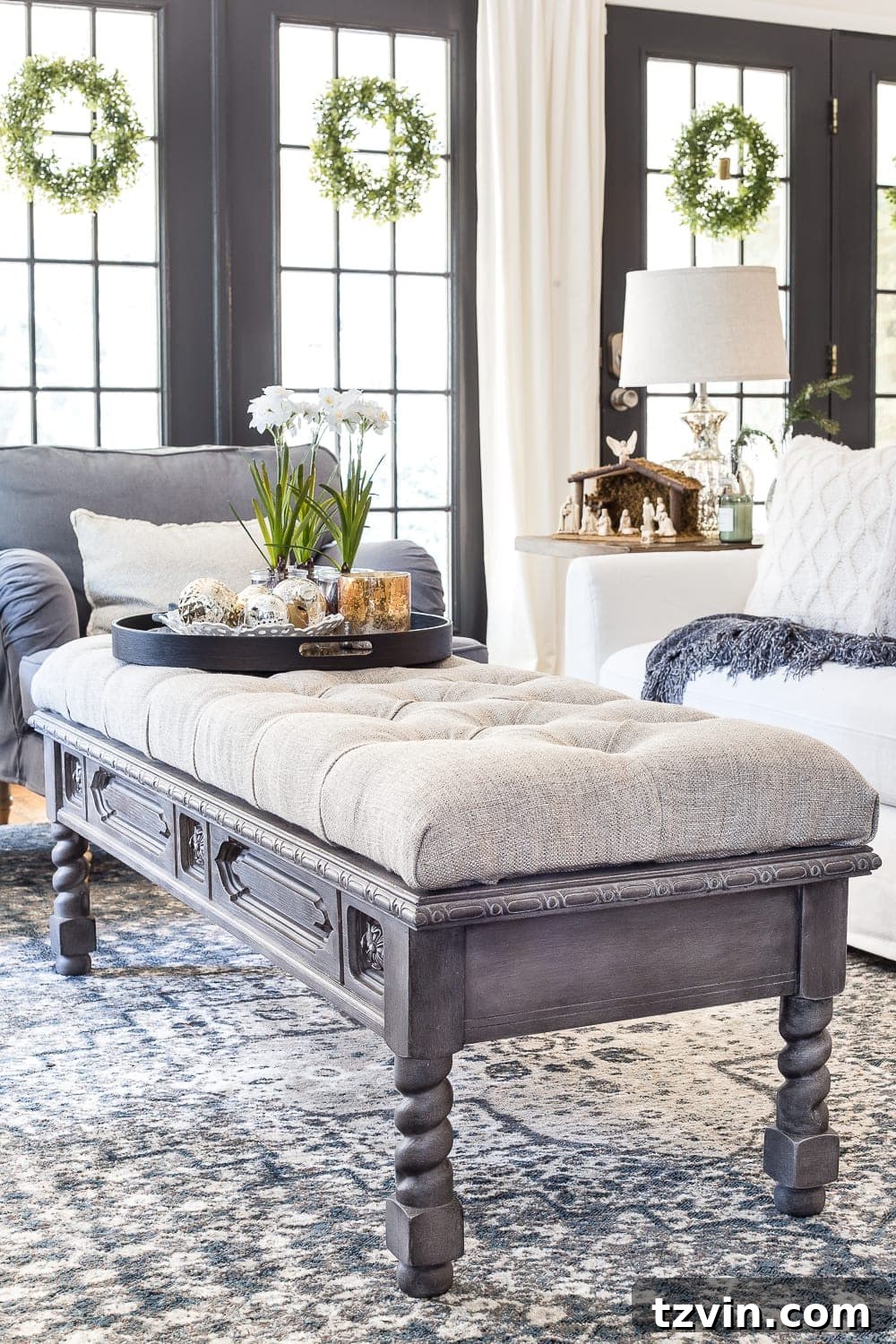 Final assembly of tufted ottoman top onto weathered coffee table base