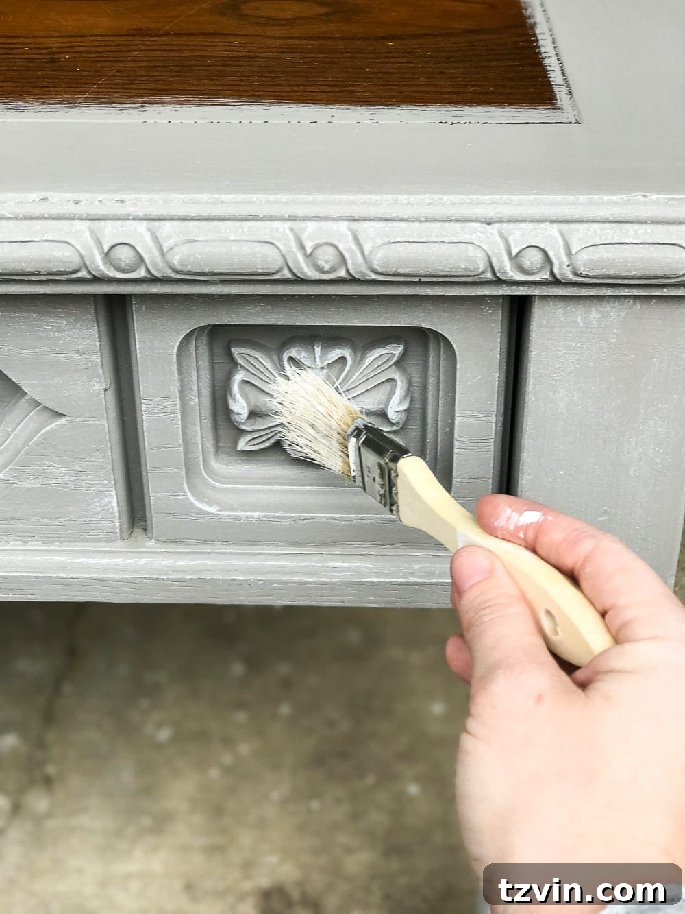 Dry brushing technique with white paint on coffee table