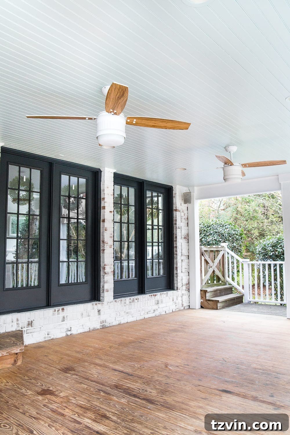 limewashed brick black French doors and haint blue porch ceiling