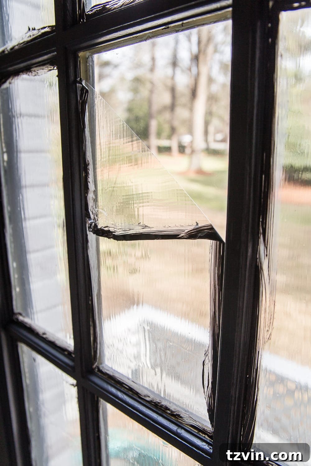 clean glass pane after peeling masking liquid from a French door
