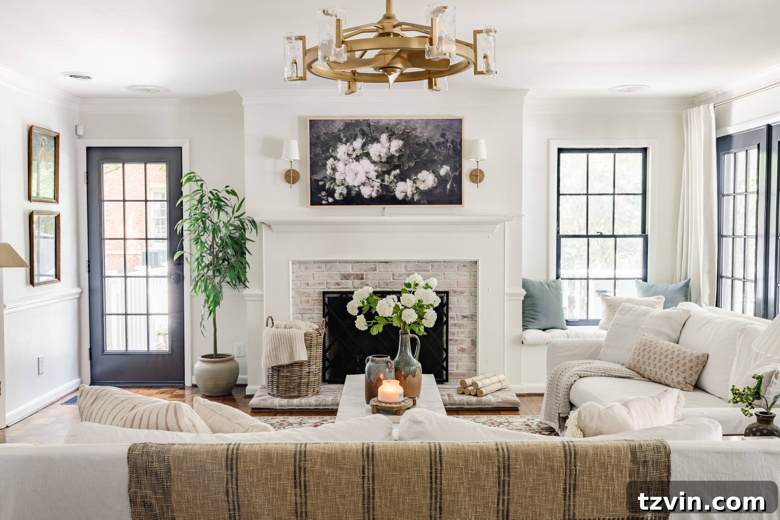 living room after renovation with painted black French doors and updated decor