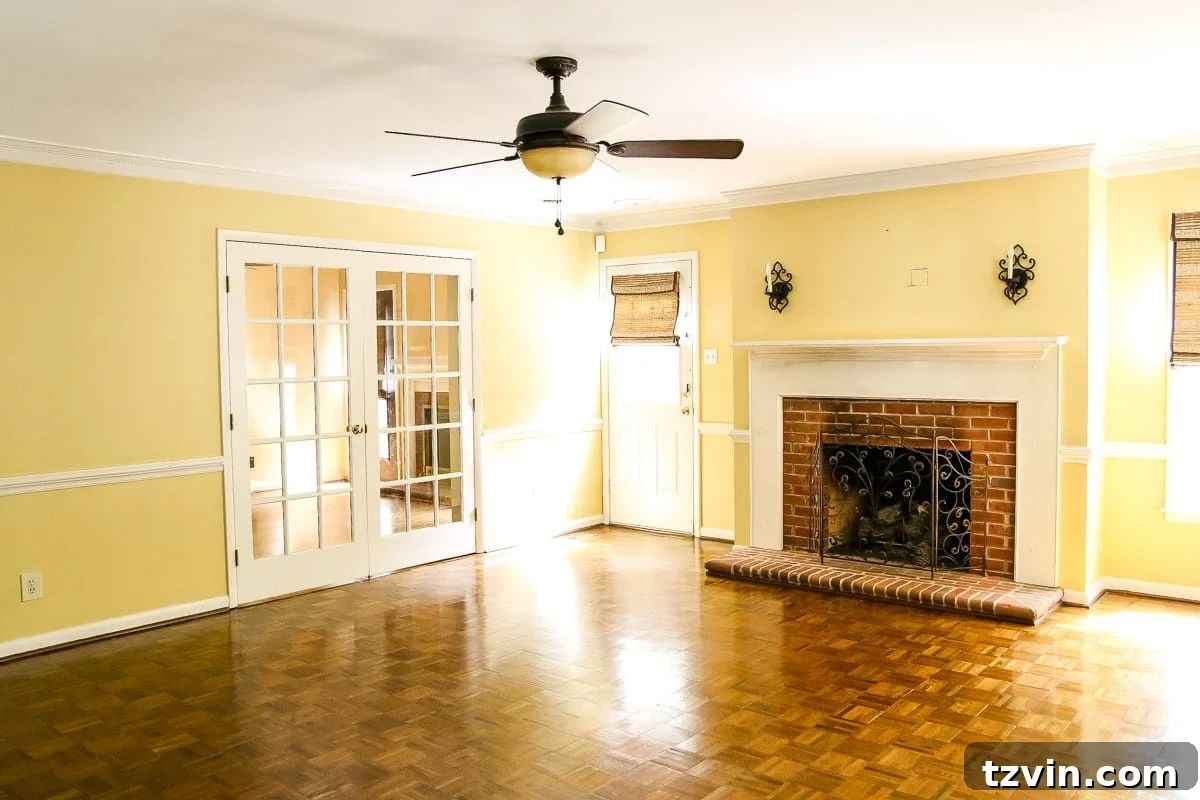old yellow living room before renovation with a non-functional door