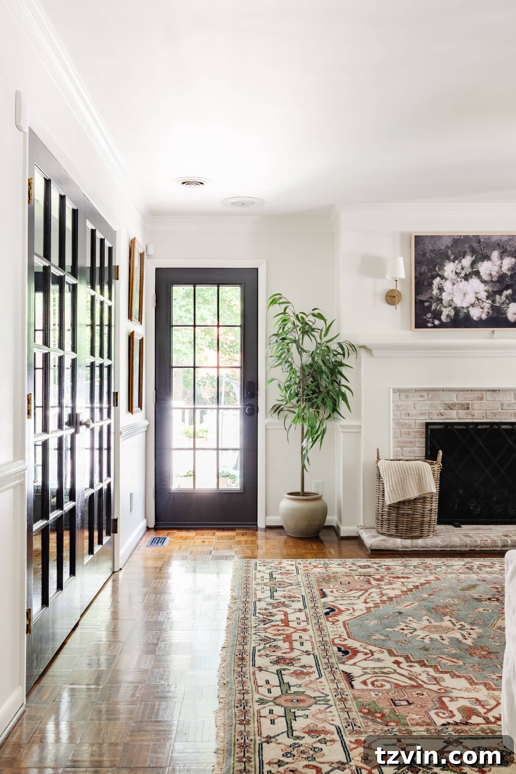 beautifully painted black French door in a renovated living room