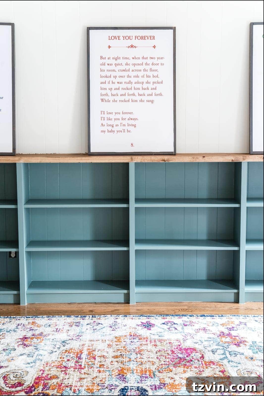 Custom Playroom Library Corner 20 The completed and painted IKEA Billy built-ins, now ready for organization with baskets and decorative items.