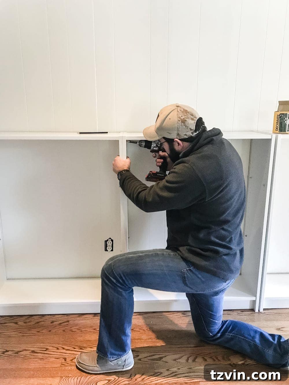 Custom Playroom Library Corner 6 IKEA Billy bookcases positioned against the wall, ready for final placement and anchoring in the DIY built-in project.