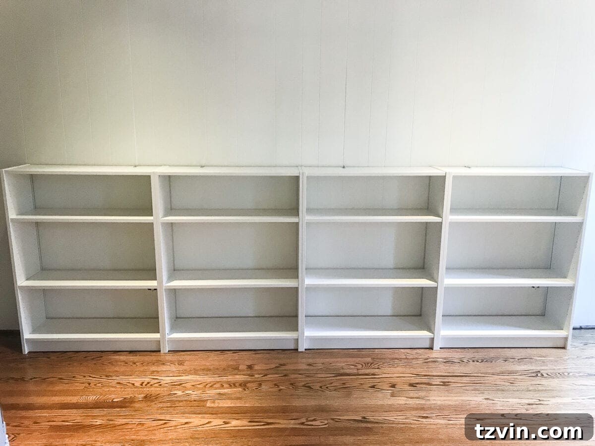 Custom Playroom Library Corner 9 The IKEA Billy bookcases securely installed and ready for custom wood trim and top in a DIY built-in project.