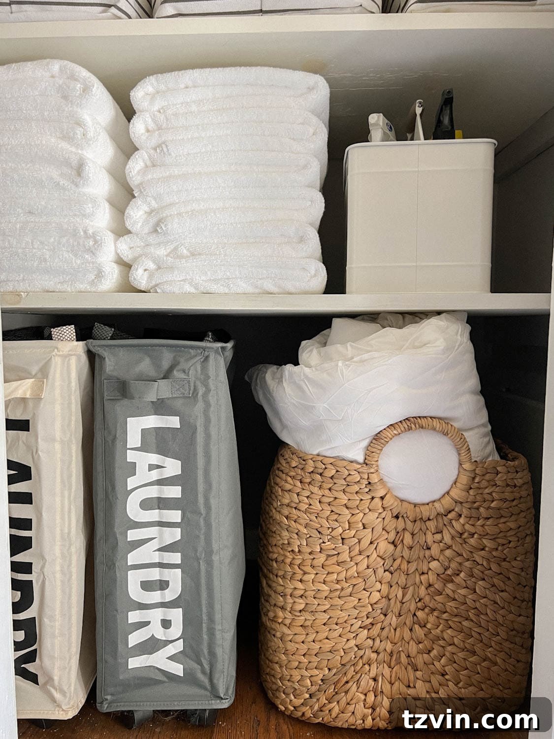 Flawless Bathroom Linen Closet Organization Ideas 5 back of white towels on bathroom linen closet shelving with cleaning caddy and laundry. hampers
