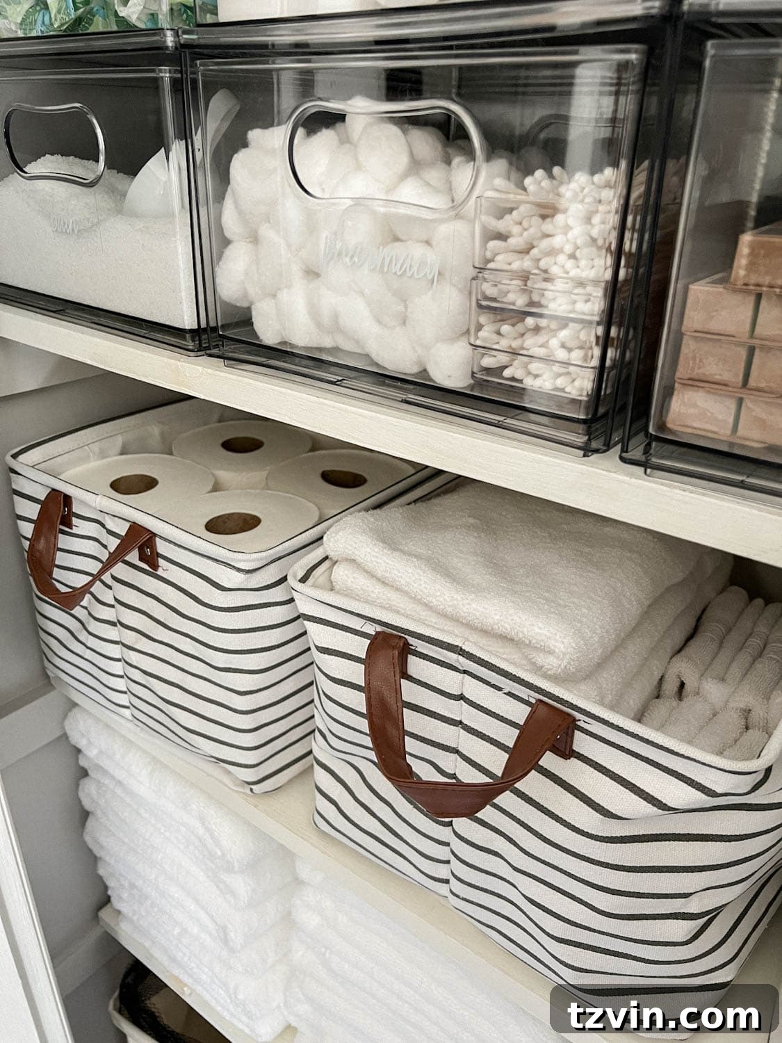 Flawless Bathroom Linen Closet Organization Ideas 10 bins storing towels, toilet paper, and toiletries