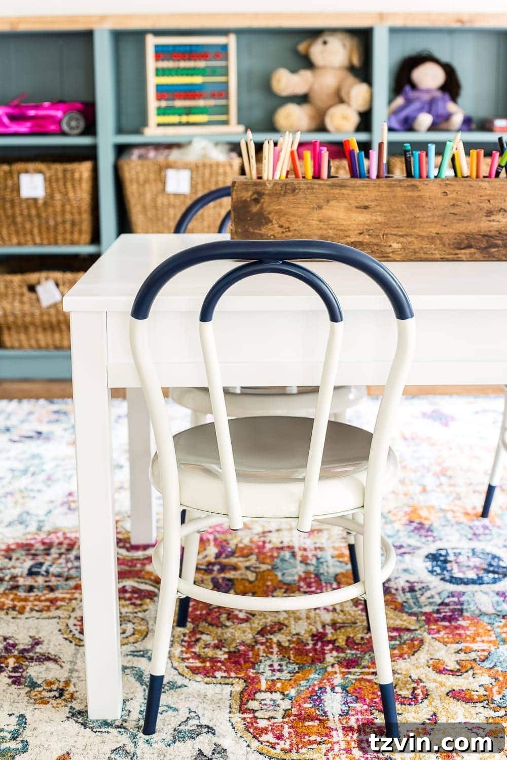 Playroom Transformed: Brighter Spaces, Comfier Places 6 White adjustable play table in a child's playroom, ideal for drawing and creative projects.