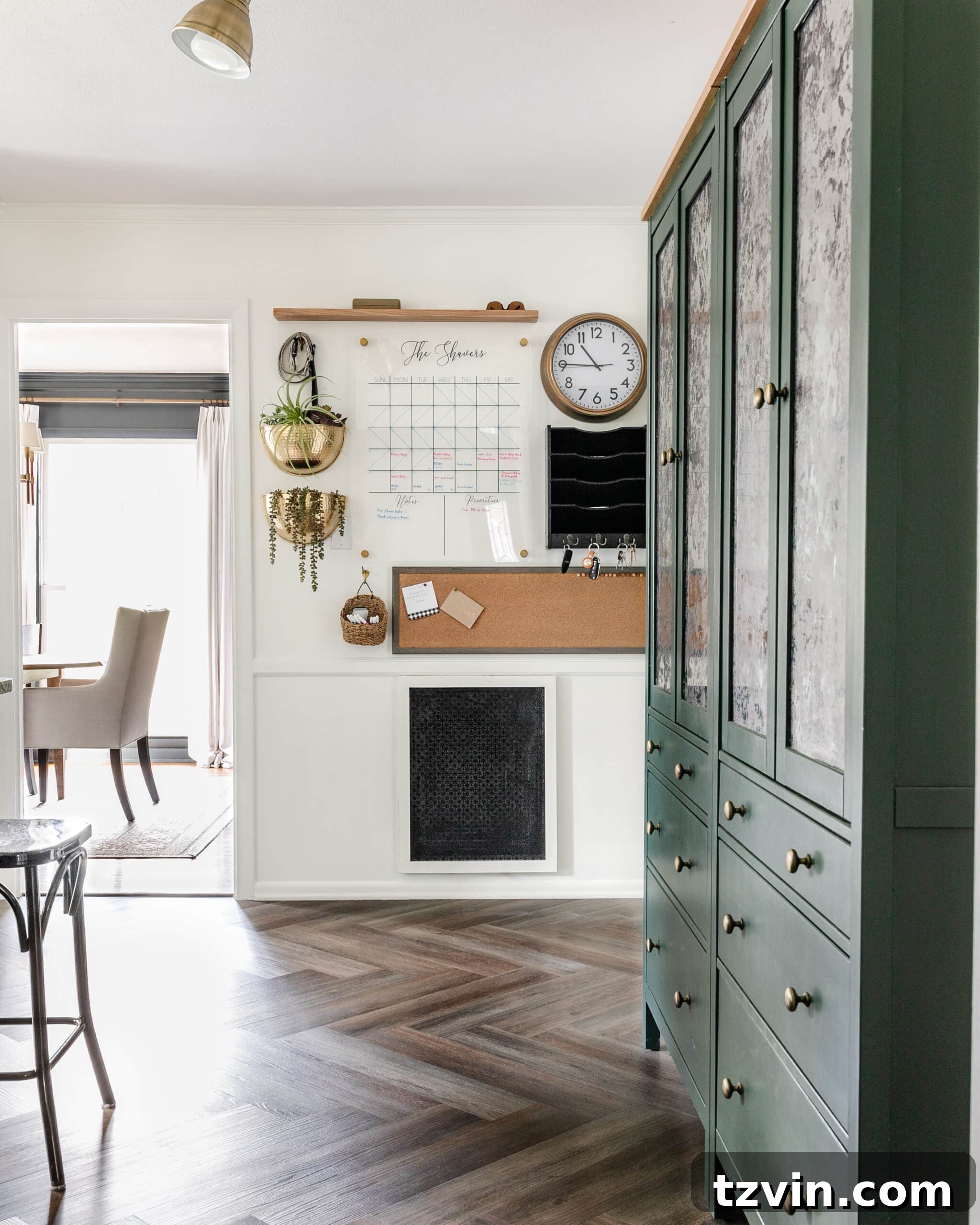 Organizing Your Family: Command Center Essentials 2 family command center in a kitchen with herringbone floors and green cabinets