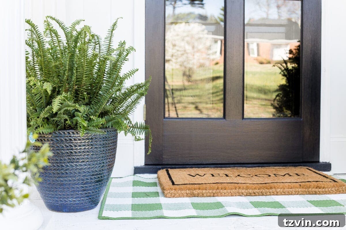 Small Stoop, Big Style: 4 Simple Decorating Steps 6 4 easy steps to decorate a small porch stoop for spring to make any home more welcoming for guests. #springporch #smallporch #porchstoop
