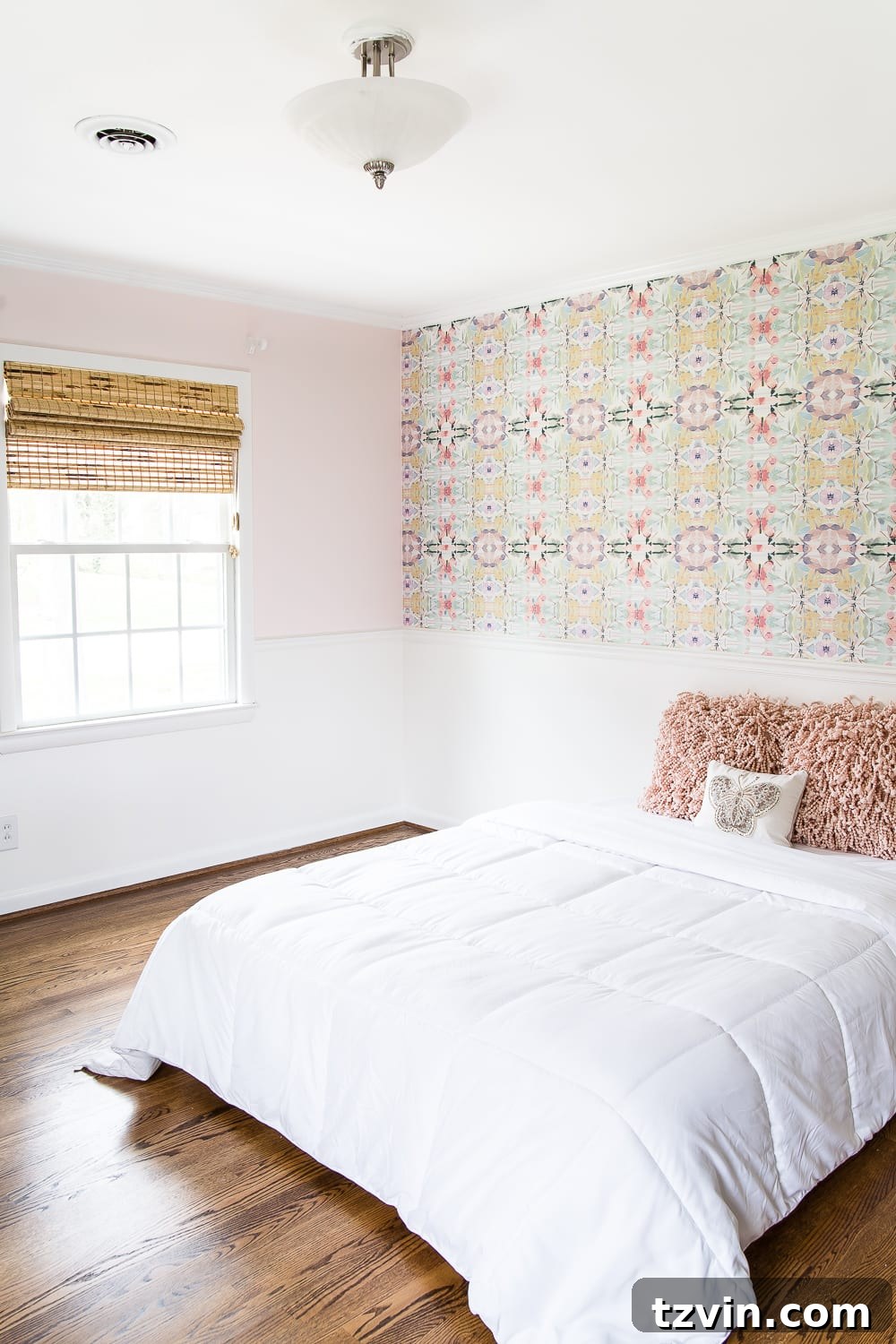 A sweet pastel little girl bedroom makeover with Behr My Sweetheart and retro wallpaper to transition into pre-teen/teenage years. #girlbedroom #kidsdecor #wallpaper #pinkpaint