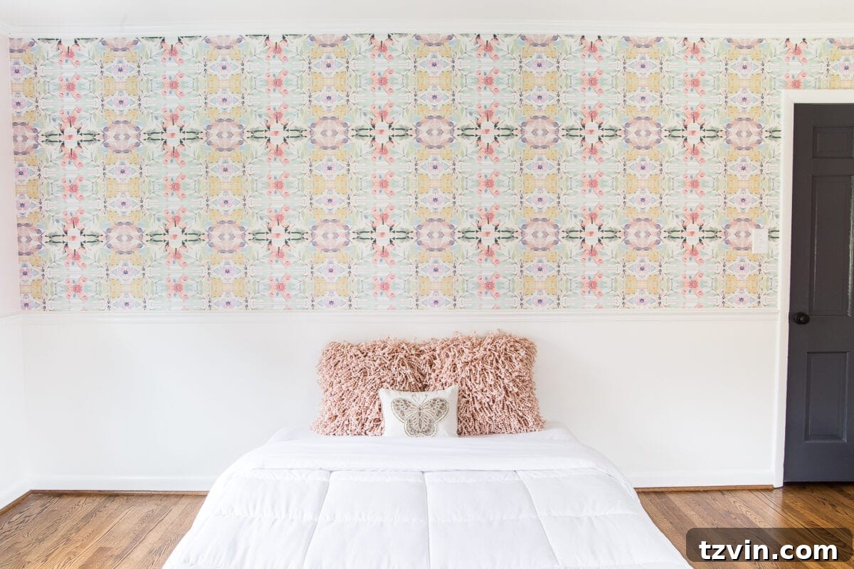 A sweet pastel little girl bedroom makeover with Behr My Sweetheart and retro wallpaper to transition into pre-teen/teenage years. #girlbedroom #kidsdecor #wallpaper #pinkpaint