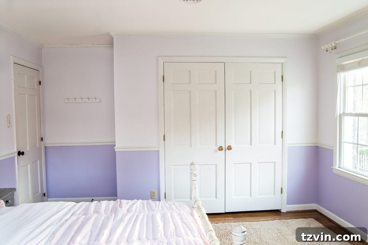 A sweet pastel little girl bedroom makeover with Behr My Sweetheart and retro wallpaper to transition into pre-teen/teenage years. #girlbedroom #kidsdecor #wallpaper #pinkpaint