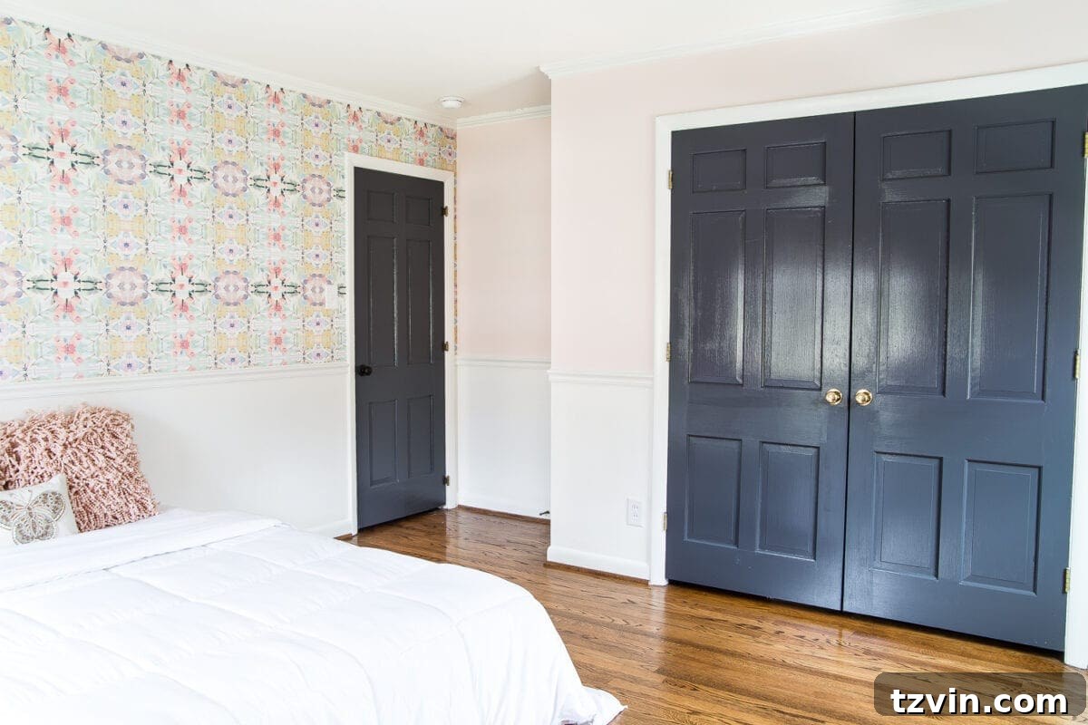 A sweet pastel little girl bedroom makeover with Behr My Sweetheart and retro wallpaper to transition into pre-teen/teenage years. #girlbedroom #kidsdecor #wallpaper #pinkpaint