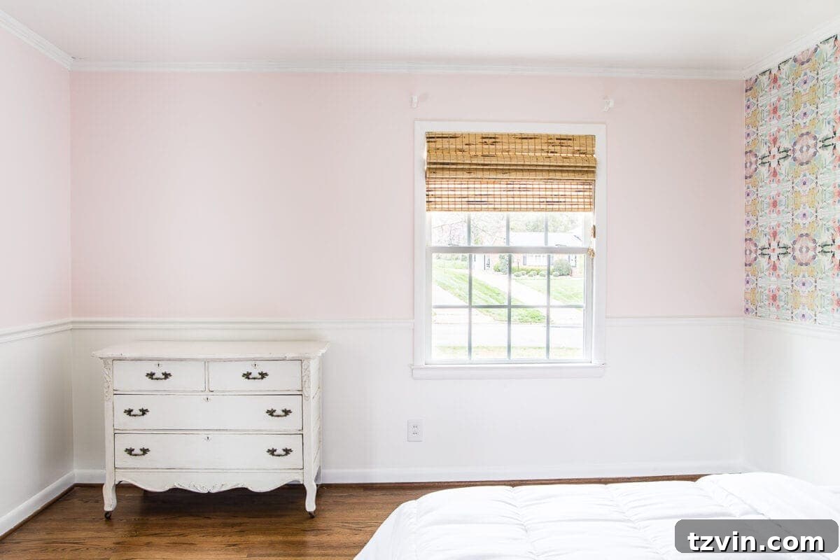 A sweet pastel little girl bedroom makeover with Behr My Sweetheart and retro wallpaper to transition into pre-teen/teenage years. #girlbedroom #kidsdecor #wallpaper #pinkpaint
