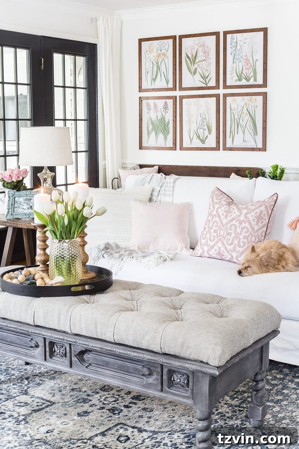 Spring Refresh Living Room Reveal 4 Bright and airy living room corner with a cozy sofa, layered throws, and decorative pillows, setting a perfect 'spring living room' scene.