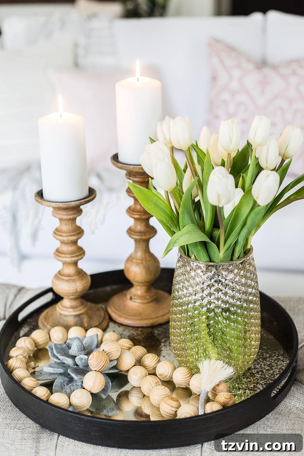Spring Refresh Living Room Reveal 6 Styled ottoman featuring spring florals and decorative items, showcasing 'easy home decor' and 'living room styling'.